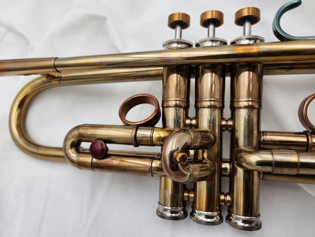 Del Quadro Dorotea custom trumpet with an acid burn, lacquered finish and Blood Basin Jasper custom button inlays