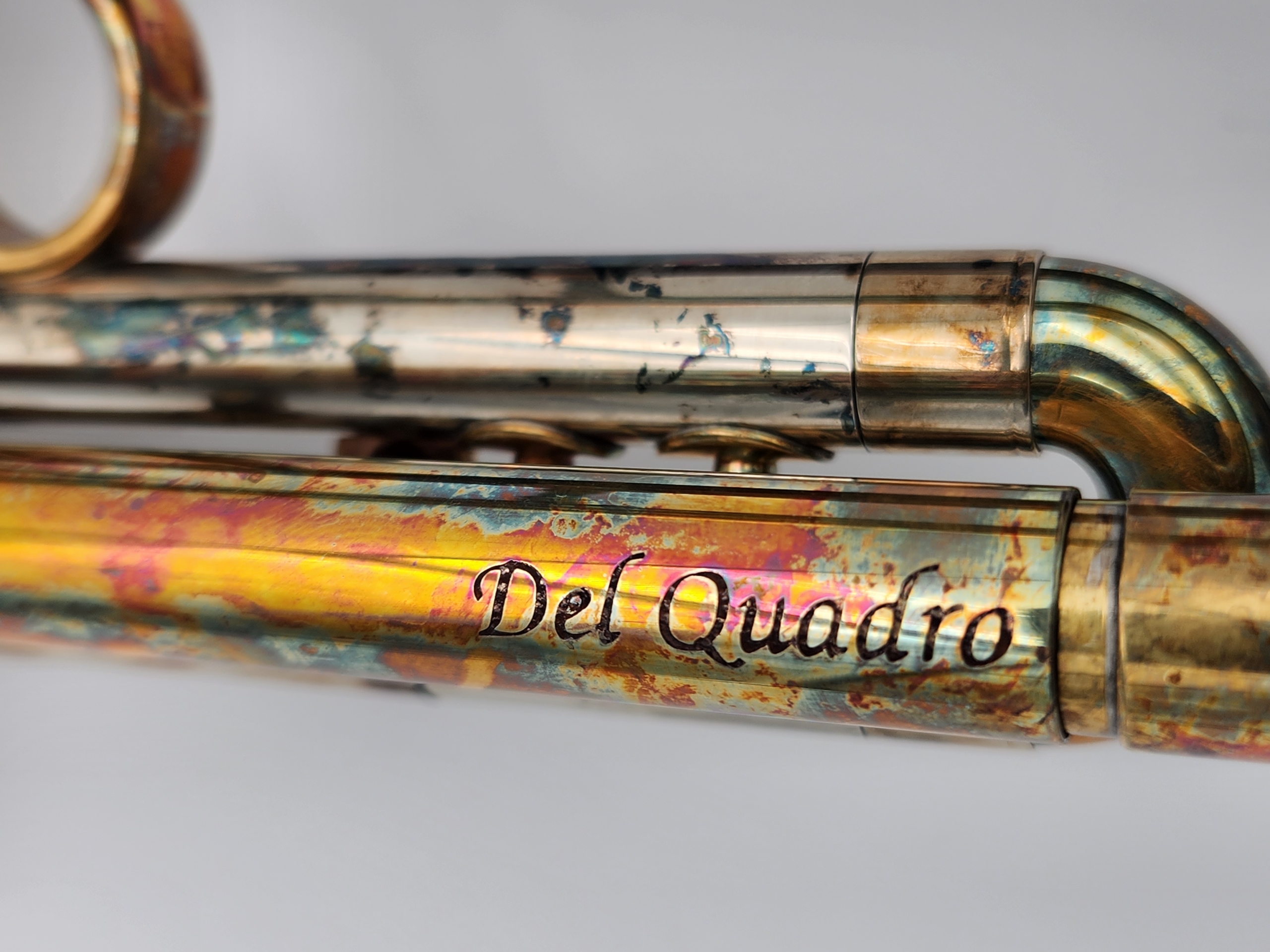 Del Quadro Custom Grizzly Trumpet in a Colorful Acid Burn Finish with Purple Chariot Button and Stopscrew Inlays